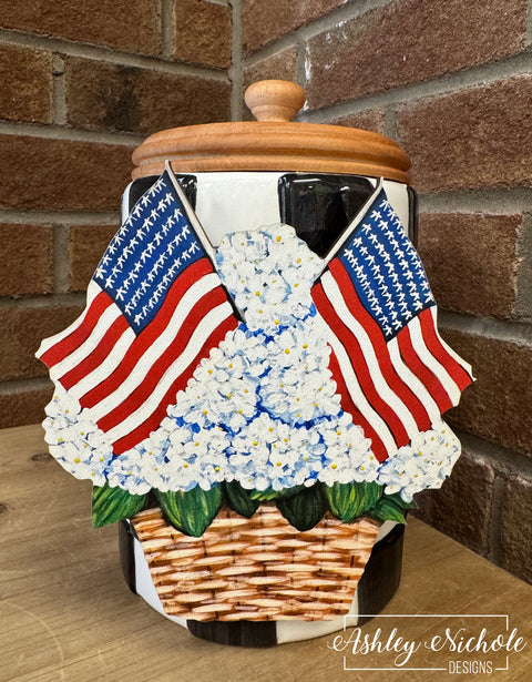 Decorative item with American flags and flowers on a brick wall background