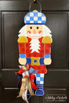 Regal Nutcracker Christmas Door Hanger - BLUE & RED